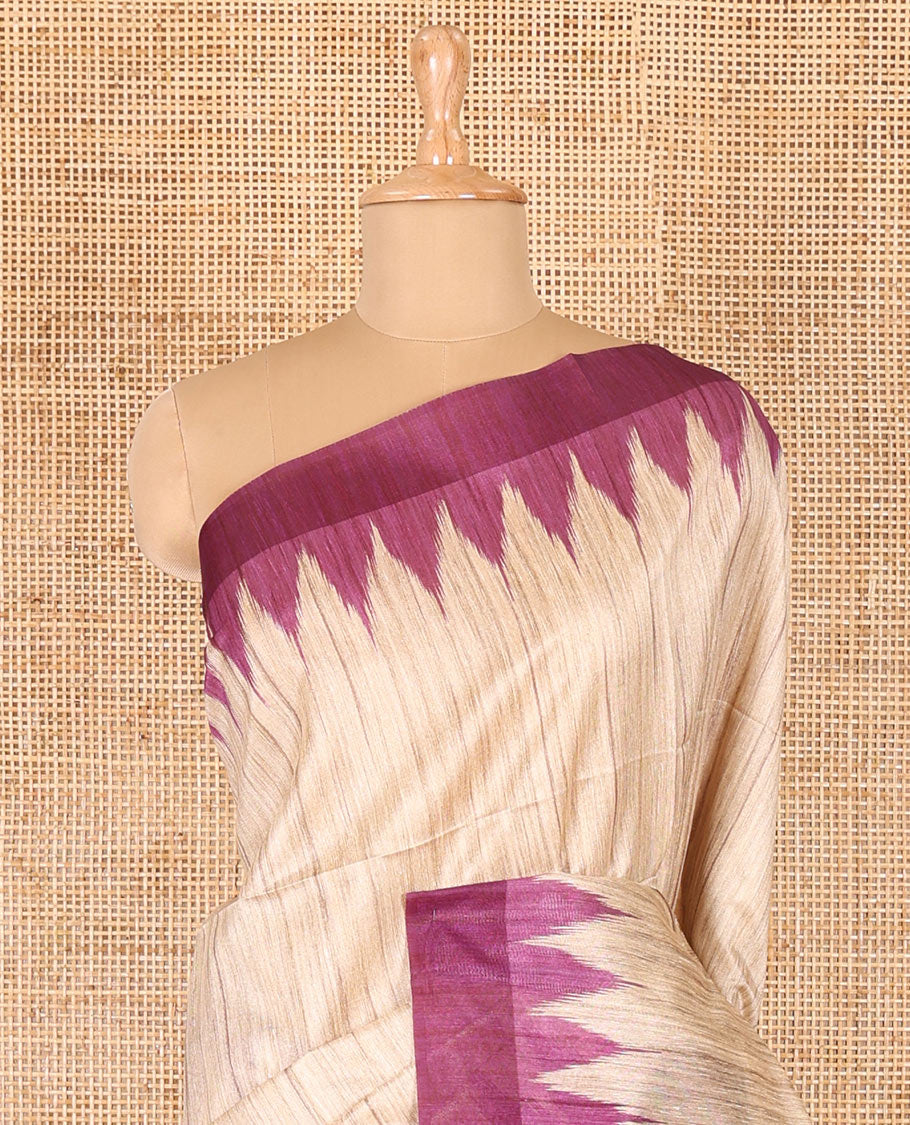Chikku-purple plain Khicha katan silk saree, contrast purple temple border, ikkat printed pallu with tassels, and a contrast blouse