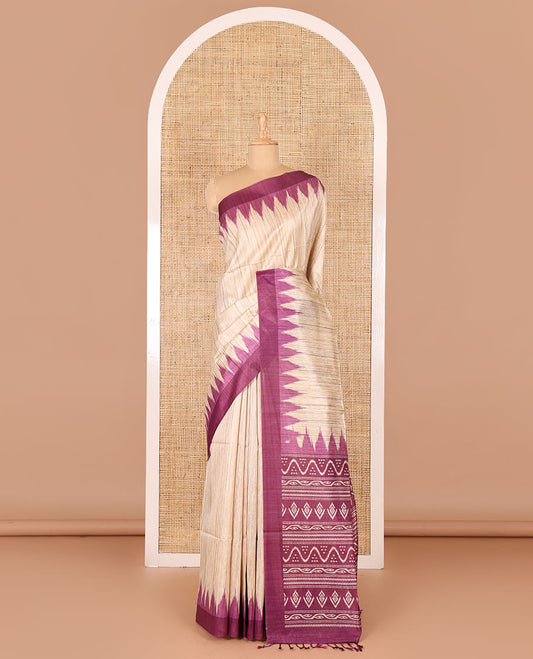 Chikku-purple plain Khicha katan silk saree, contrast purple temple border, ikkat printed pallu with tassels, and a contrast blouse