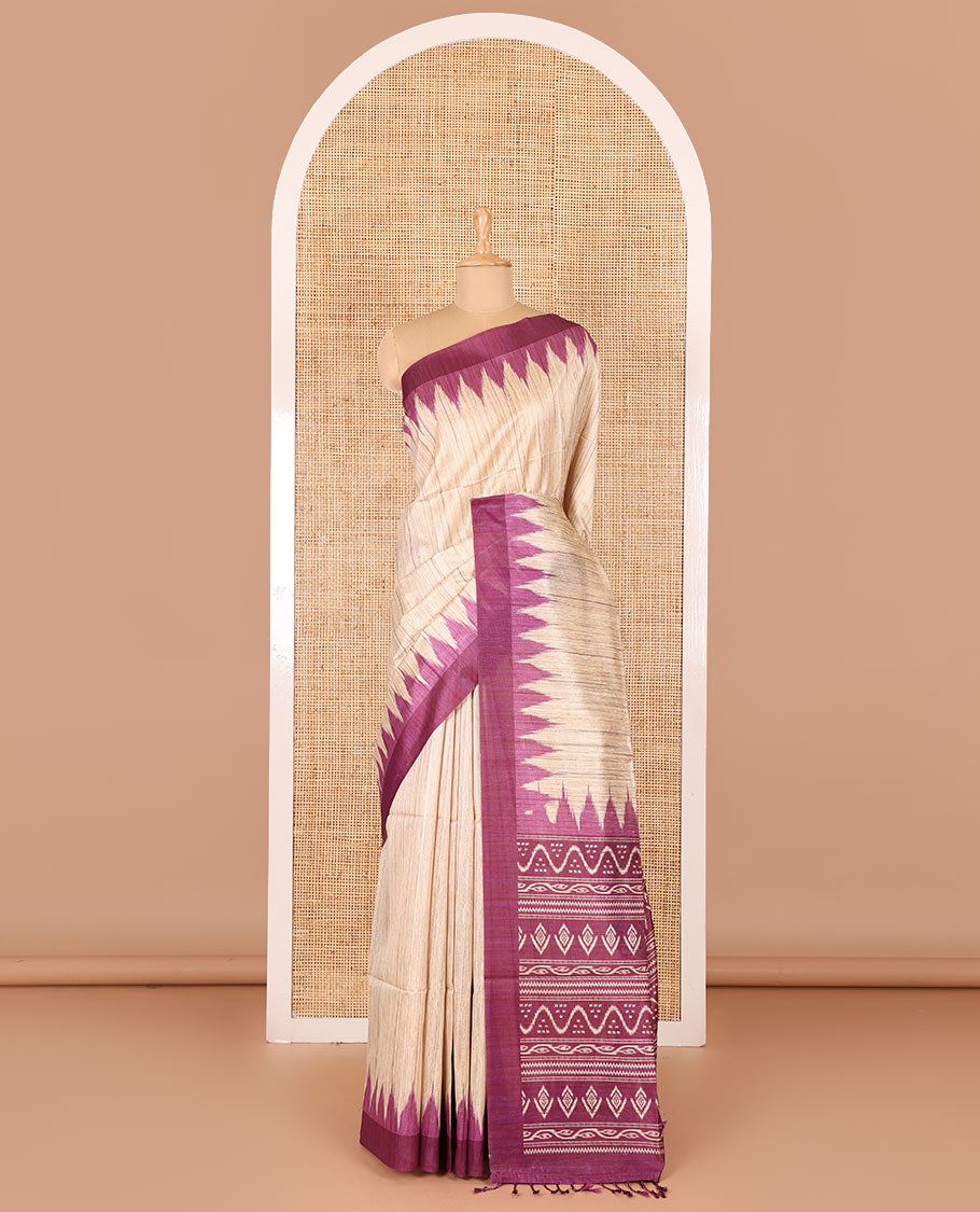 Chikku-purple plain Khicha katan silk saree, contrast purple temple border, ikkat printed pallu with tassels, and a contrast blouse