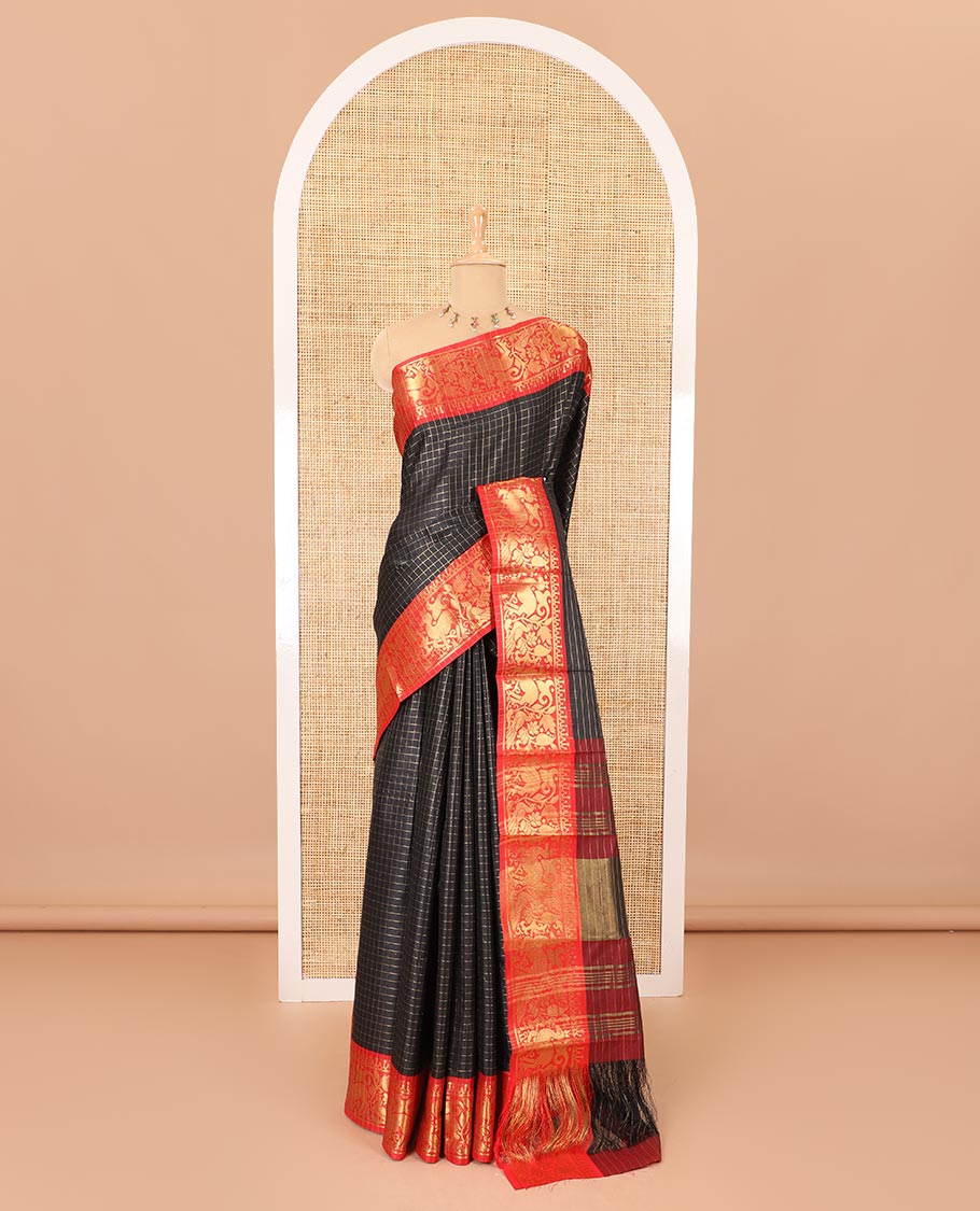 Black golden zari checked semi-taffeta saree, contrast zari border of deer and peacock motifs, striped pallu, and a contrast zari design blouse