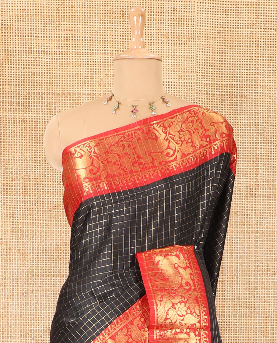 Black golden zari checked semi-taffeta saree, contrast zari border of deer and peacock motifs, striped pallu, and a contrast zari design blouse