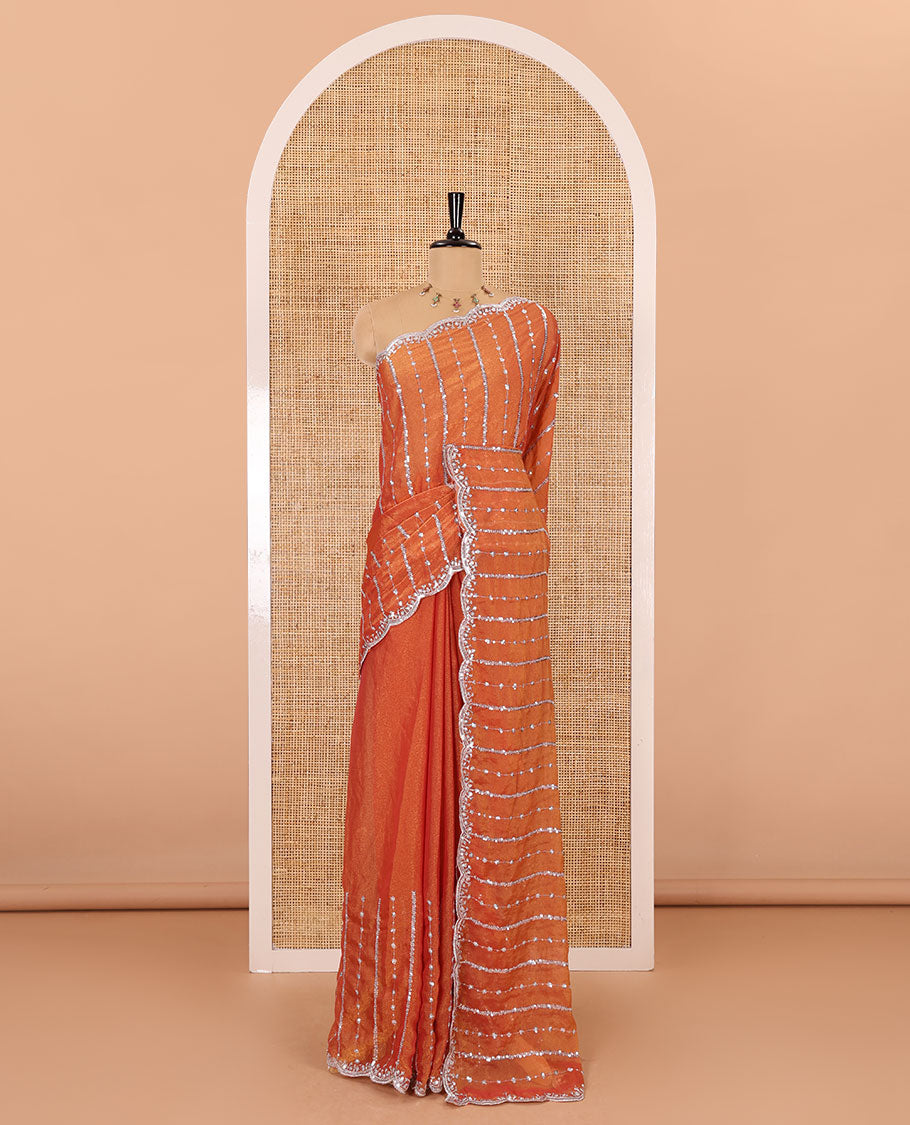 Orange vertical stripes embroidered shimmer chiffon saree, scallop embroidered border, embroidered pallu, and fancy embroidered matching blouse