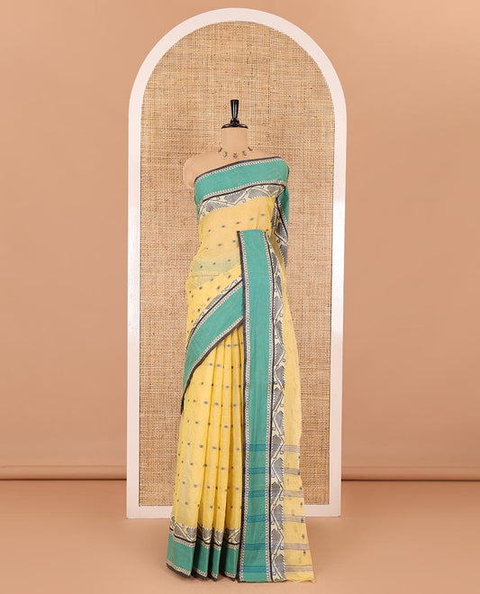 Yellow buttas Bengal cotton saree, contrast jamdani floral creeper design, and pallu of stripes, and buttas