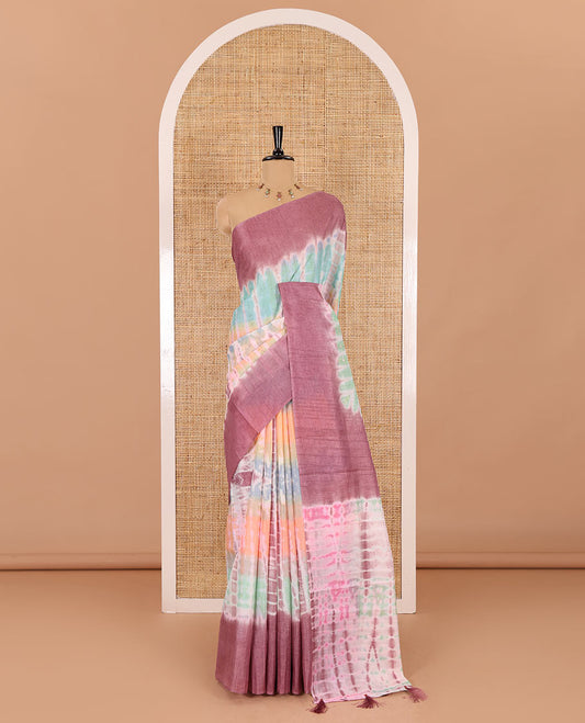 Multi color shibori printed jute tussar saree, contrast plain border, plain pallu with tussels, and contrast plain blouse