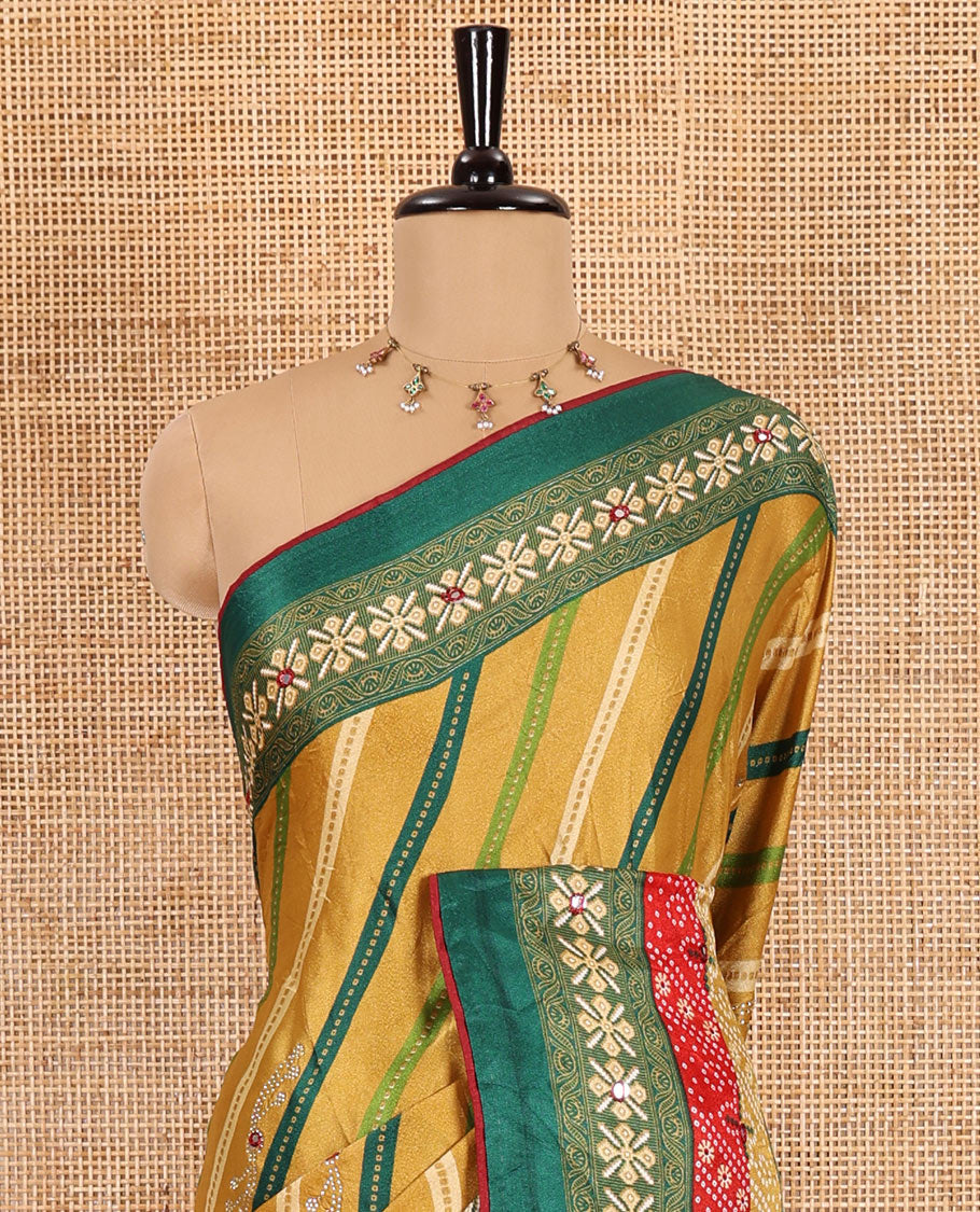 Gold leheriya striped printed, mirror and stone work moss chiffon saree, contrast bandhani printed mirror work border, floral print, mirror and stone work pallu with a contrast plain blouse