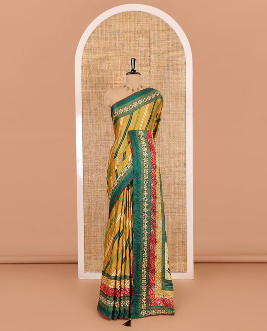 Gold leheriya striped printed, mirror and stone work moss chiffon saree, contrast bandhani printed mirror work border, floral print, mirror and stone work pallu with a contrast plain blouse