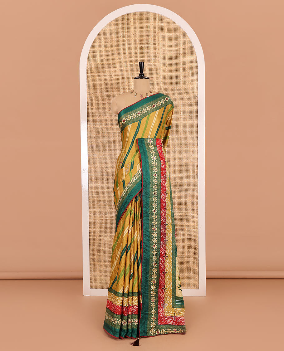 Gold leheriya striped printed, mirror and stone work moss chiffon saree, contrast bandhani printed mirror work border, floral print, mirror and stone work pallu with a contrast plain blouse