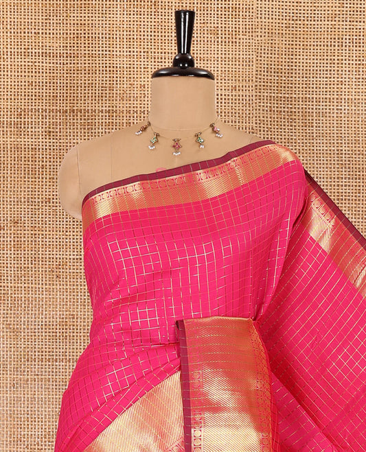 Rani pink zari checked semi-katan silk saree, traditional zari border, zari-rich pallu, and a matching blouse