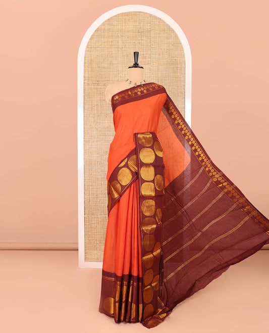 Rust orange plain sungudi cotton saree, contrast big rudraksham motifs woven border, striped pallu, and a contrast plain blouse