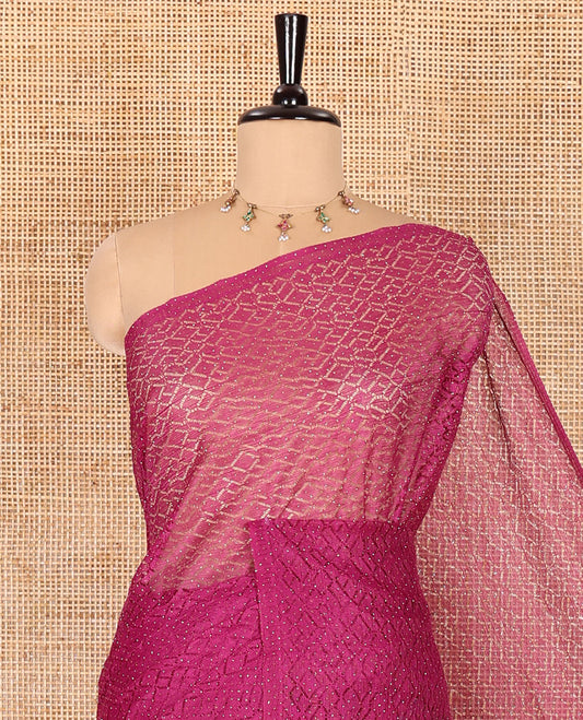 Borderless wine sparkling glitter russel net saree with self-pallu, and a contrast floral printed and zig-zag patterned blouse