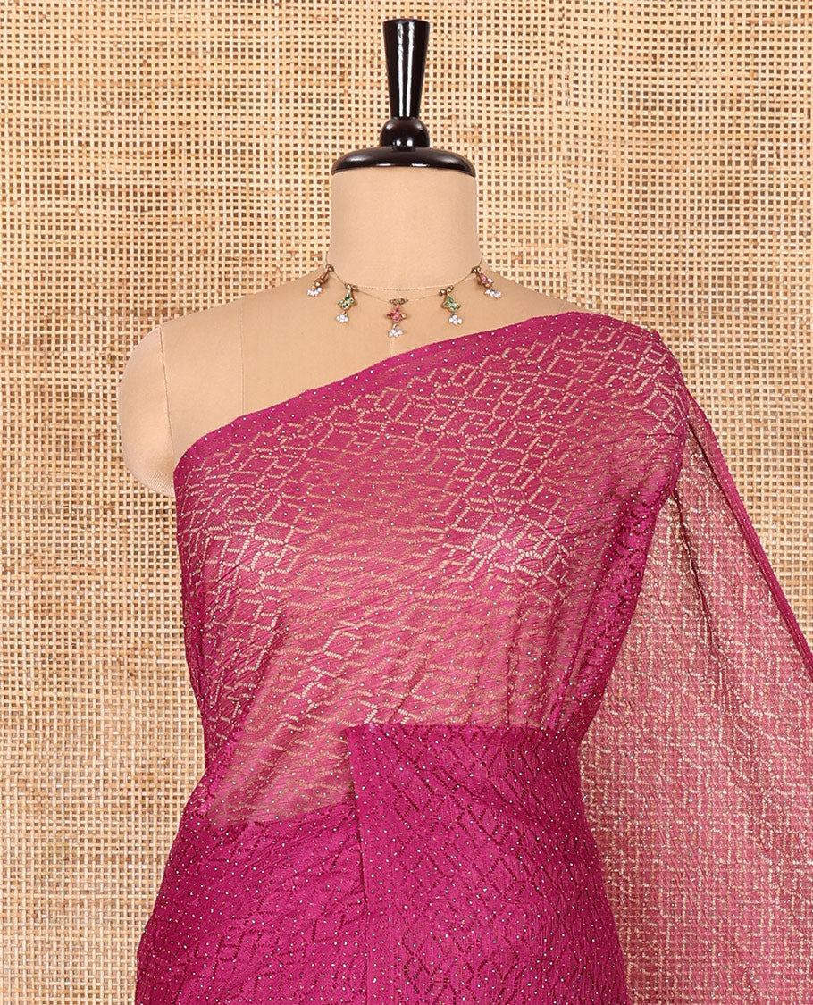 Borderless wine sparkling glitter russel net saree with self-pallu, and a contrast floral printed and zig-zag patterned blouse