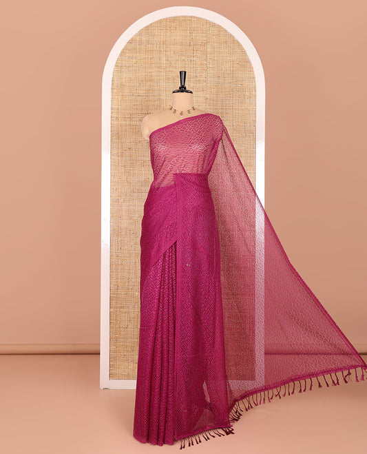Borderless wine sparkling glitter russel net saree with self-pallu, and a contrast floral printed and zig-zag patterned blouse