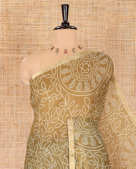 Green bandhani-style floral and chakra printed saree, zari piping border, contrast ajrakh printed pallu, and contrast ajrakh printed blouse
