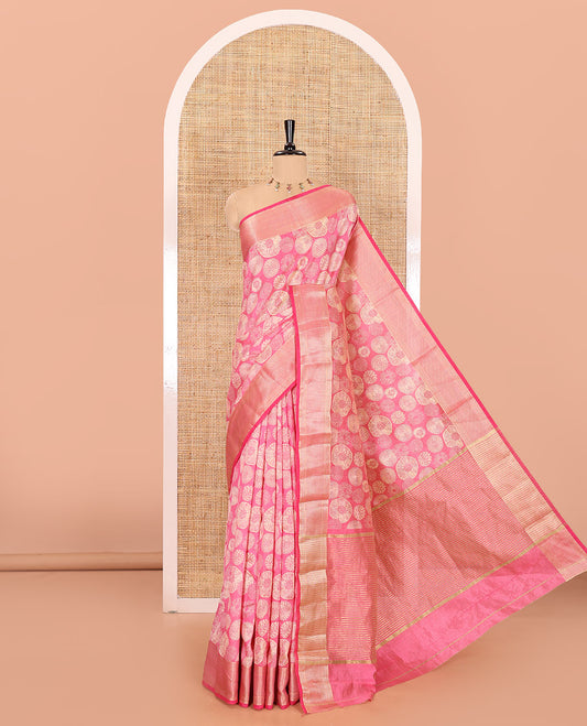 Pink lotus-leaf style printed semi-tussar saree, traditional zari border, zari striped pallu, and a matching blouse