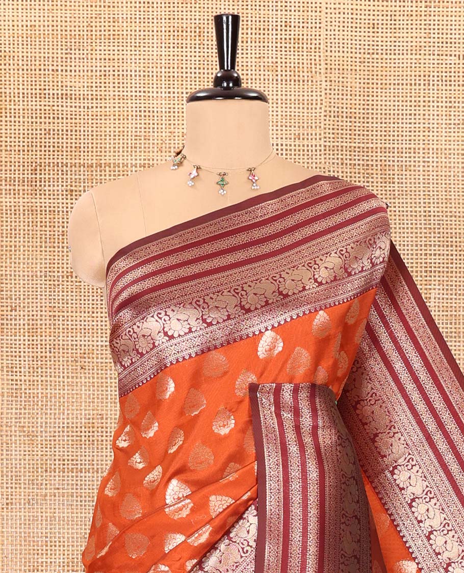 Rust orange zari buttas kanchi silk saree, contrast traditional zari border of peacock designs, intricate pallu, and a zari design pallu