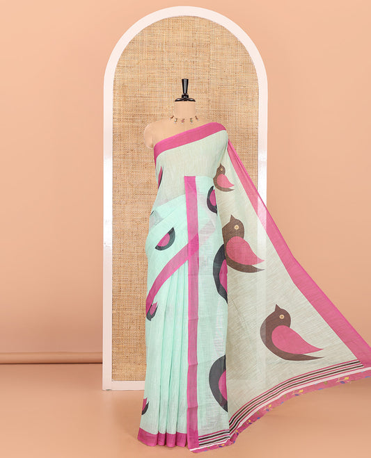 Pista green birds motifs linen cotton saree with contrast plain border , birds mofits pallu and leaf printed blouse