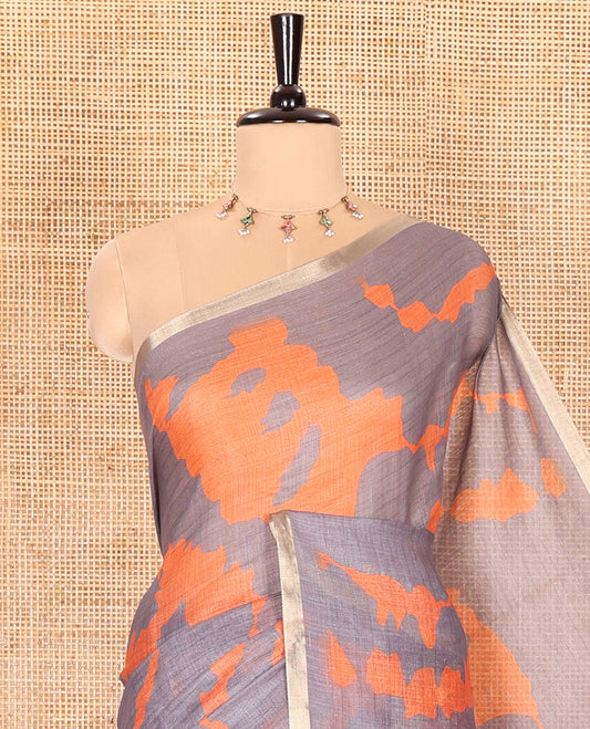 Grey shibori printed linen cotton saree, piping border, contrast floral printed pallu, and a contrast floral printed blouse