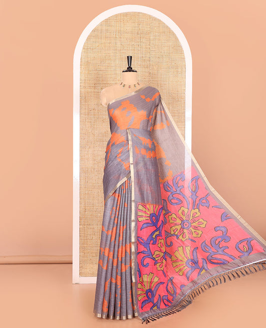 Grey shibori printed linen cotton saree, piping border, contrast floral printed pallu, and a contrast floral printed blouse