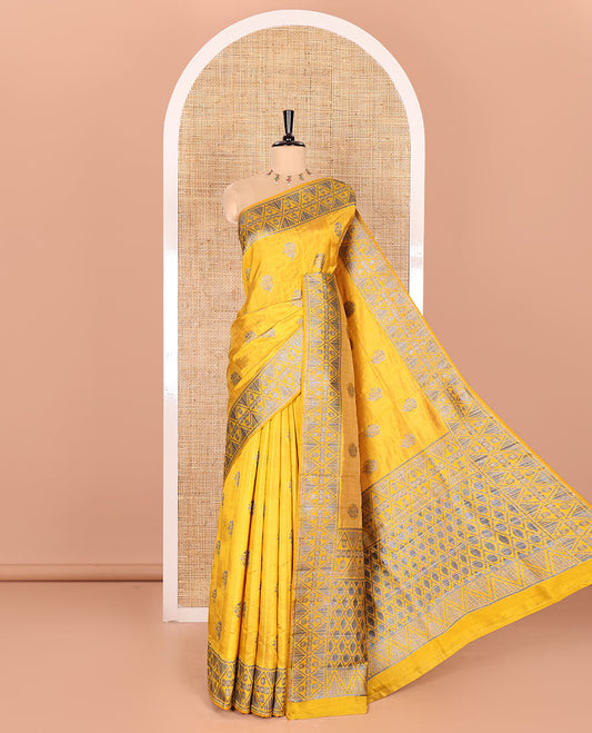 Mustard Semi-Tussar Saree Subtly Woven With Floral Zari Buttas, Featuring a Geometric-Patterned Zari Border, Adorned With a Butta-Enclosed Checked Pallu, and a Matching Blouse
