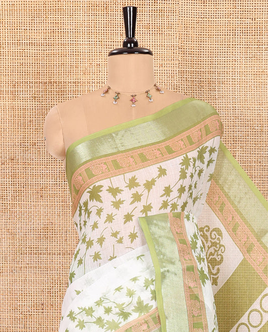 White and Green Linen Cotton Saree Featuring Field Maple Leaf Motifs Printed All Over the Body, Complemented by a Contrast Zari and Peacock-Printed Border, Pallu of Geometric Print, and Paired with a Contrast Checked Blouse