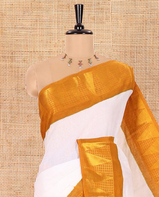 Off-White and Mustard Plain Sungudi Cotton Saree Accentuated with a Contrast Border of Temple and Zari Checks Designs, Subtly Zari Striped Pallu, and Paired with a Contrast Blouse