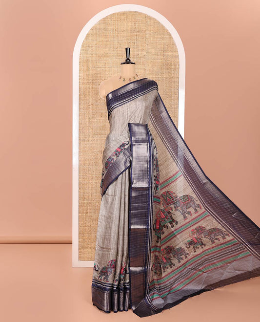 Grey and Blue Dola Silk Saree Subtly Designed with Checks and Elephant Motifs Print, Complemented by a Contrast Traditional Zari Design Border, Pallu Depicting Elephant Motifs Print, and Paired with a Contrast Blouse