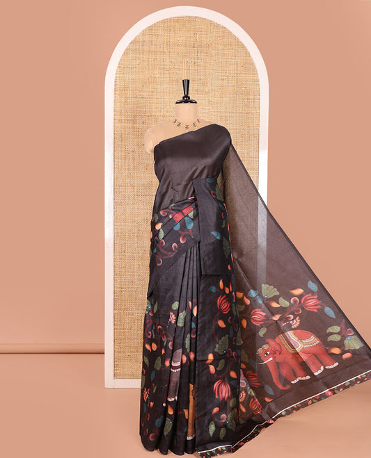 Borderless Black Linen Cotton Saree, Artfully Printed with Kalamkari-Style Floral Vine, and Elephant Motifs, Pallu Mirroring the Kalamkari Print, and Paired with a Matching Printed Blouse