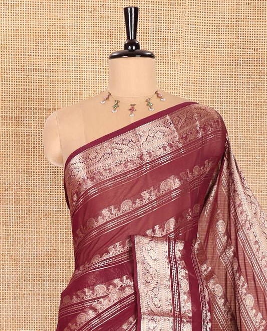 Purple Georgette Saree, Accentuated with Zari Peacock Designs All Over Its Body, Highlighted by a Traditional Zari Border, Gracefully Zari-Decked Pallu, and Paired with a Matching Brocade Blouse