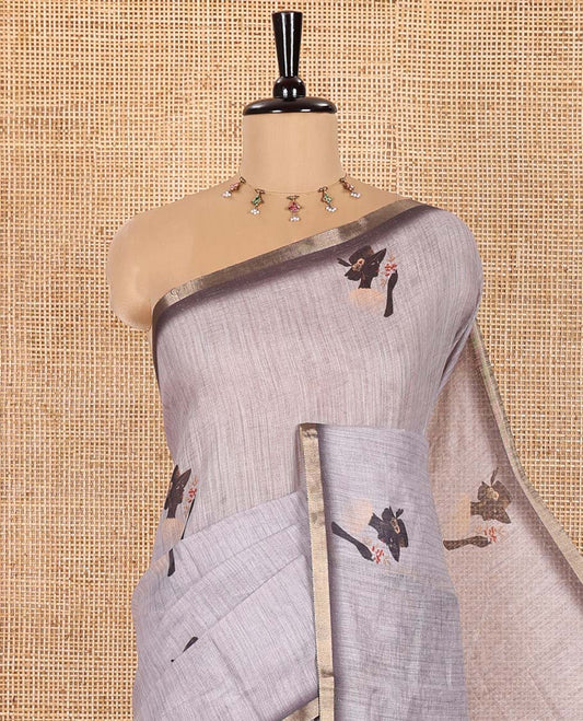 Grey Linen Saree Creatively Printed with Girl Motifs All Over Its Body, Subtly Sparkled with Piping Zari Border, Pallu Mirrors the Same Body Print, and Paired with a Contrast-Printed Blouse