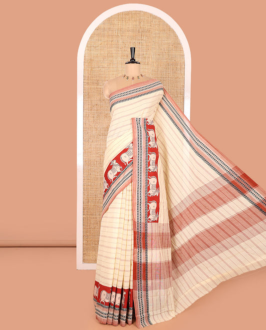Cream and Red Mangalagiri Cotton Saree, Subtly Sparkled with Horizontal Stripes and Pichwai Cow Print All Over Its Body, Complemented by Contrast Border of Temple and Paisley Design, and Paired with a Contrast Pichwai Cow Printed Blouse