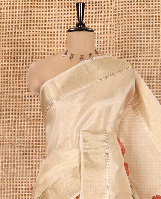 Gold Tissue Saree, Highlighted by Vibrant Floral Motifs Printed All Over Its Body, Gleamed Up with a Zari Border, Pallu with a Realistic Floral Print, and Paired with a Matching Printed Blouse