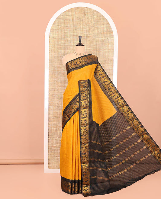 Mustard Sungudi Cotton Saree, Subtly Sparkled with Checks on Its Body, Complemented by a Contrast Temple Border of Peacock Motifs, Pallu Steeped with Stripes, and Paired with a Contrast Blouse