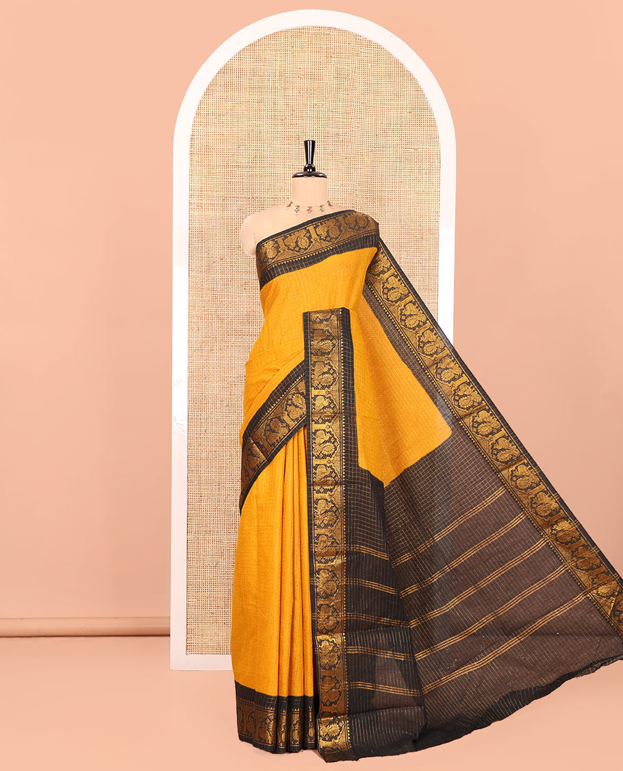 Mustard Sungudi Cotton Saree, Subtly Sparkled with Checks on Its Body, Complemented by a Contrast Temple Border of Peacock Motifs, Pallu Steeped with Stripes, and Paired with a Contrast Blouse