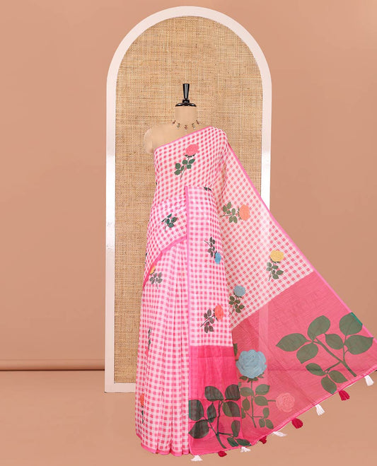 Borderless Pink Linen Cotton Saree, Adorned with Rose Floral Buttas and Checked Design on Its Body, Pallu Pictures a Beautiful Rose Floral Motifs, and Paired with a Matching Blouse