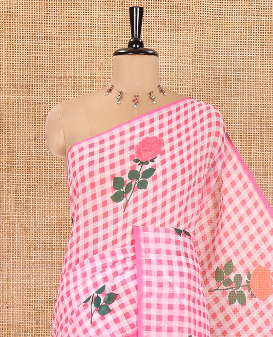 Borderless Pink Linen Cotton Saree, Adorned with Rose Floral Buttas and Checked Design on Its Body, Pallu Pictures a Beautiful Rose Floral Motifs, and Paired with a Matching Blouse