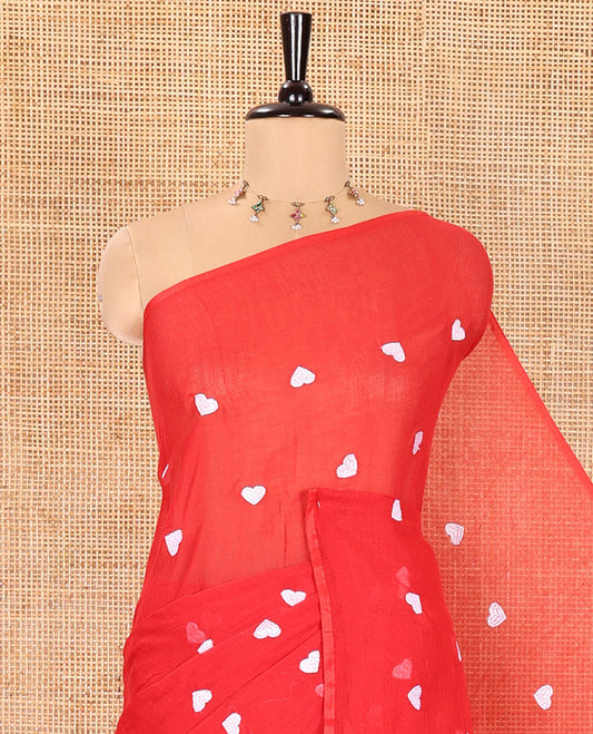 Borderless Red Khadi Mul Cotton Saree, Artfully Designed with Heart Motifs Embroidery Across Its Body, Pallu mirrors the Same Design, and Paired with a Matching Blouse