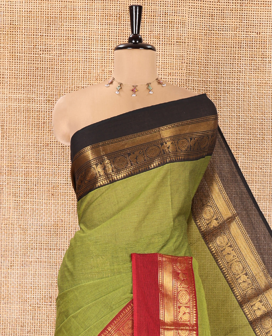 Green Plain Chettinad Cotton Saree, Complemented By Contrast Kal Eragina Traditional Zari Designs Woven Border, Subtly Striped Pallu, and Paired with a Matching Blouse
