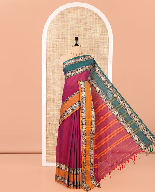 Purple Plain Mercerised Cotton Saree, Complemented by a Contrast Ganga-Jamuna Rettai Pettu Thread Border of Temple, Elephant, and Chakram Designs, Subtly Striped Pallu, and Paired with a Matching Blouse
