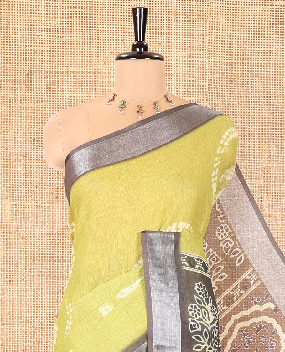 Green Linen Cotton Saree, Adorned with Shibori Printed on Its Body, Complemented by a Contrast Bavanji Zari Border, Handblock Printed Pallu, and Paired with a Contrast Blouse