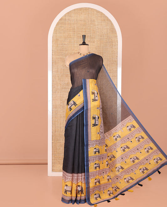 Black Linen Cotton Saree, Gleamed up with Mirror Work On Its Body, Complemented by Contrast Elephant Motifs Printed Border, Pallu Steeped with Elephant Motifs Print, and Paired with a Contrast Blouse