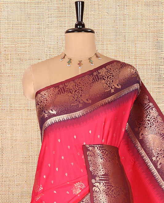 Rani Pink Elite Soft Silk Saree, Enriched with Zari Buttas on Its Body, Complemented by a Contrast Peacock-Floral Zari Blouse, Intricately Designed Pallu, and Paired with a Contrast Blouse