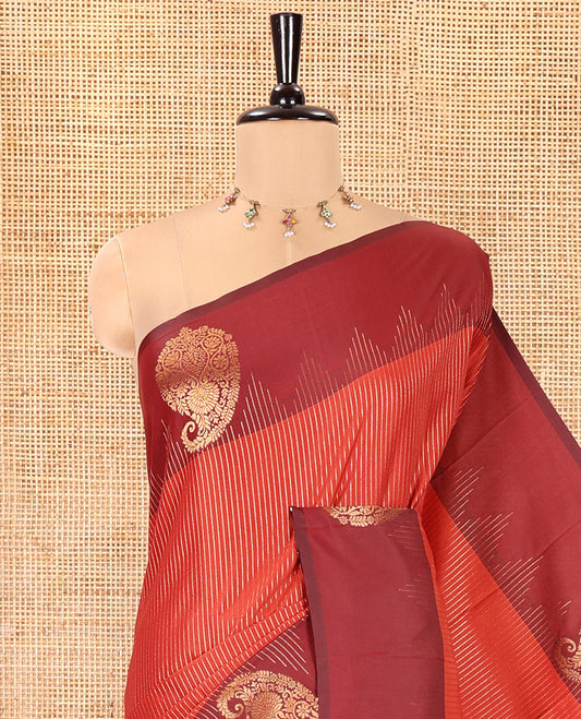 Reddish Brown Kanchi Soft Silk Saree, Majestically Detailed with Vaira Oosi, and Zari Buttas All Over Its Body, Complemented by Contrast Border of Paisleys, an Intricately Designed Pallu, and Paired with a Contrast Blouse