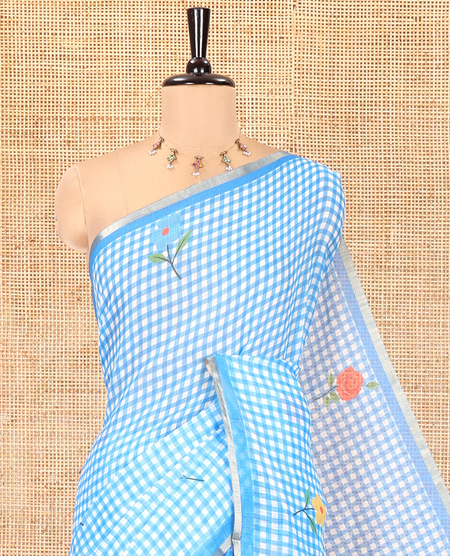 Blue Linen Cotton Saree, Decorated with Micro-Checks and Floral Motifs on Its Body, Subtle Piping Border, a Self-Pallu, and Paired with a Rose Floral Printed Blouse
