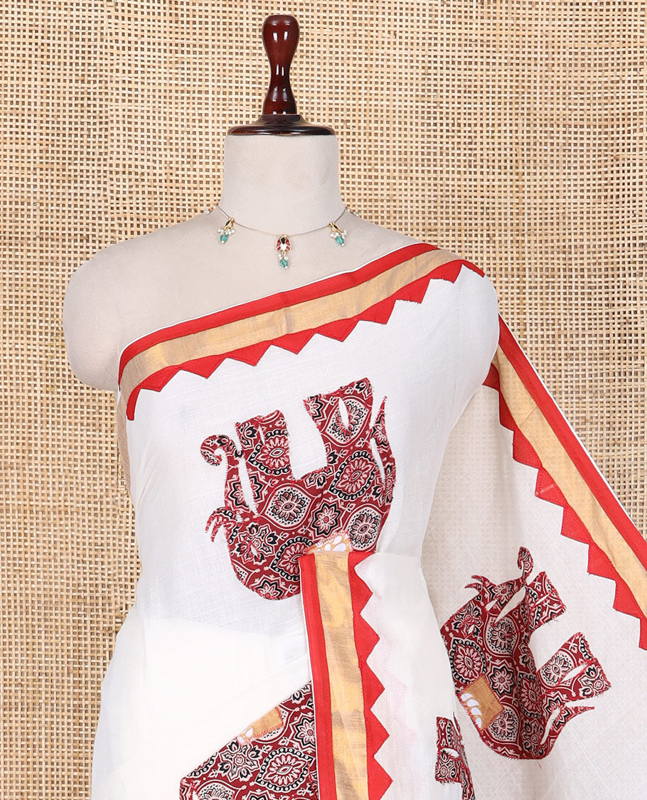 Cream Kerala Cotton Saree Features Elephant Patchwork, a Contrast Temple Border, and a Plain Blouse