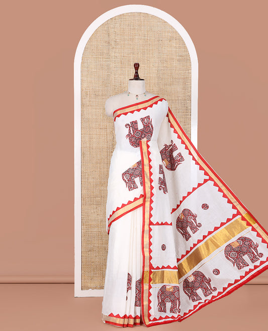 Cream Kerala Cotton Saree Features Elephant Patchwork, a Contrast Temple Border, and a Plain Blouse