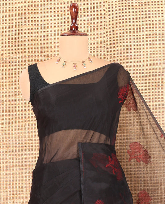 Borderless Black Semi-Silk Cotton Saree Features Floral Buttas, a Contrast Plain Pallu, and a Contrast Blouse