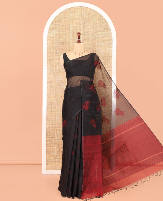 Borderless Black Semi-Silk Cotton Saree Features Floral Buttas, a Contrast Plain Pallu, and a Contrast Blouse