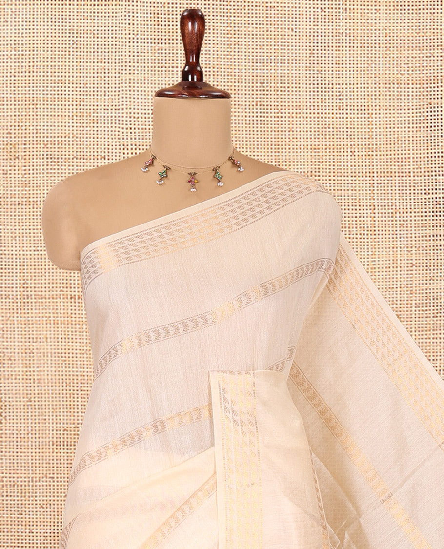 Cream Bhagalpur Cotton Saree, Gleamed Up with Zari Designs, a Subtle Zari Border, Gleaming Pallu, and a Matching Blouse