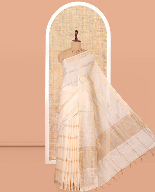 Cream Bhagalpur Cotton Saree, Gleamed Up with Zari Designs, a Subtle Zari Border, Gleaming Pallu, and a Matching Blouse