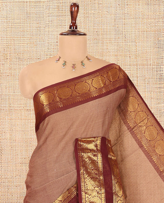 Brown Plain Chettinad Cotton Saree, Complemented by a Contrast Peacock-Chakram Rettai Pettu Border, and a Matching Blouse